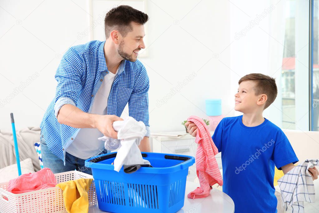 Dad and son preparing clothes 