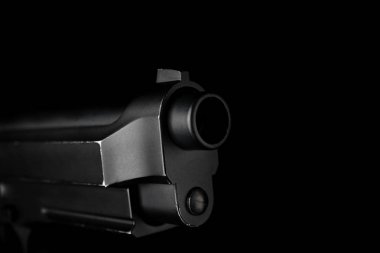 Gun barrel on black background clipart