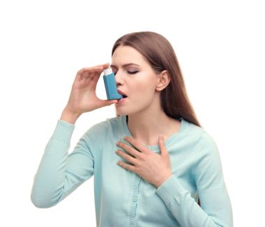 woman using asthma inhaler clipart