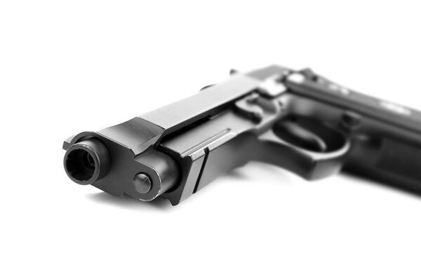 Пистолет на белом фоне
