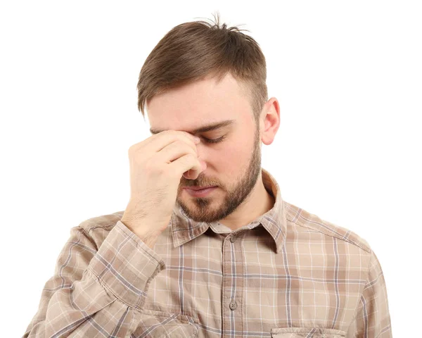 Jeune homme souffrant de maux de tête sur fond blanc — Photo