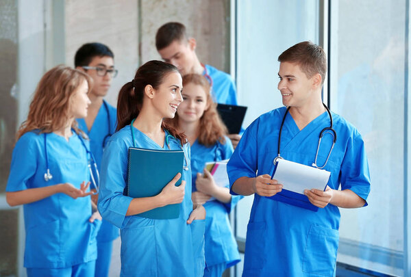 Young students in hall of university indoors