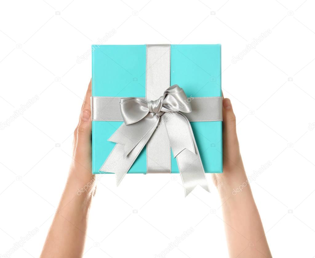 Hands holding beautiful gift box