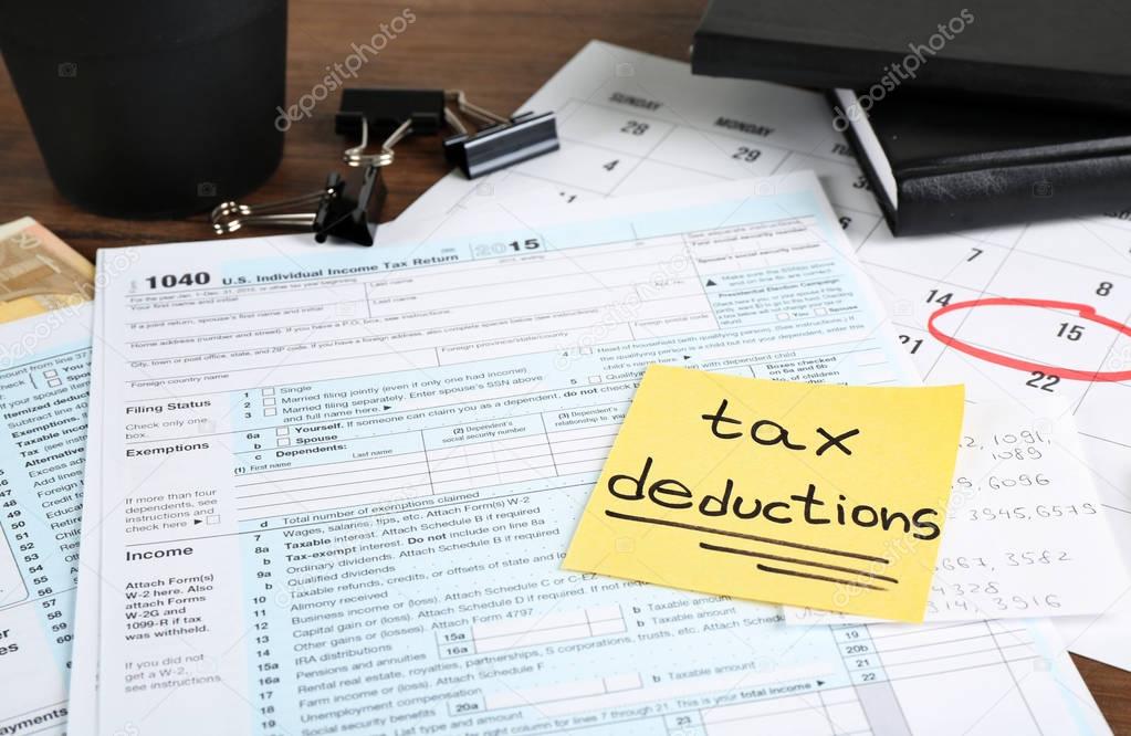 Paper sheet with text TAX DEDUCTIONS 