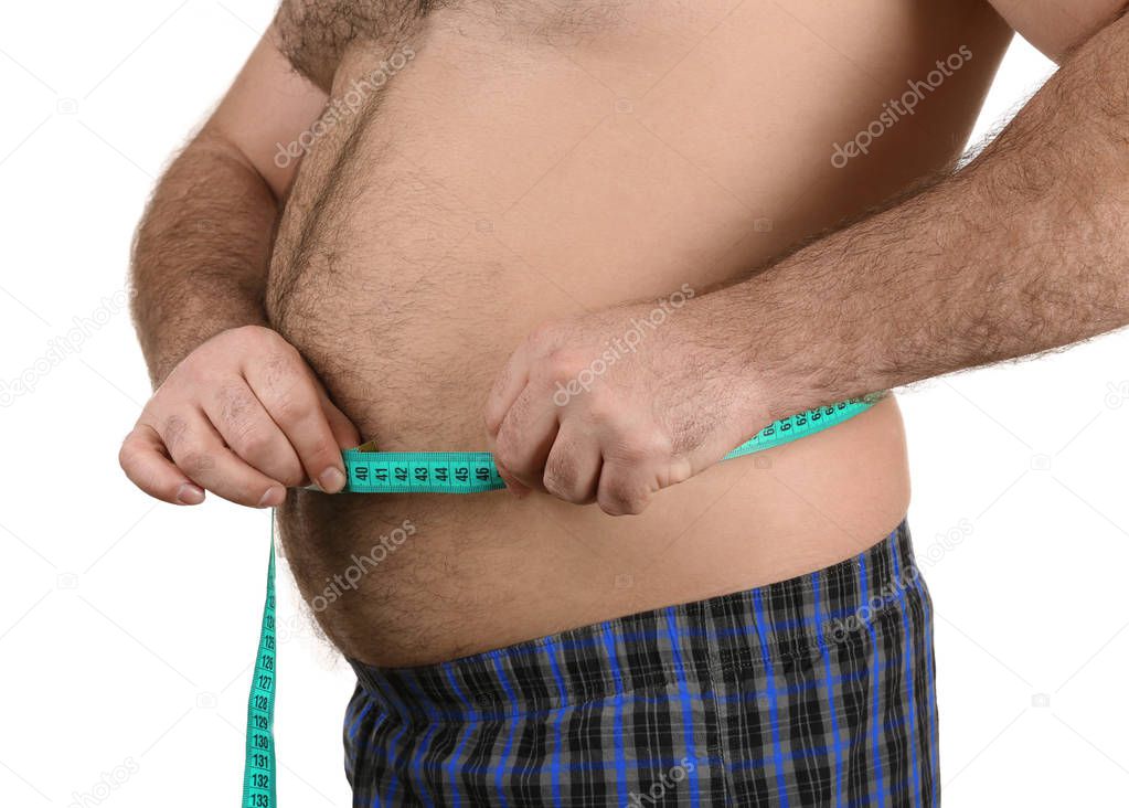 Man measuring beer belly 