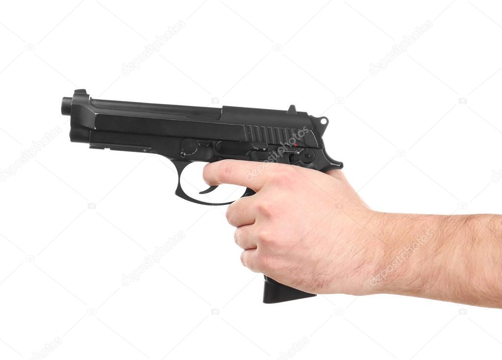 Man's hand holding gun