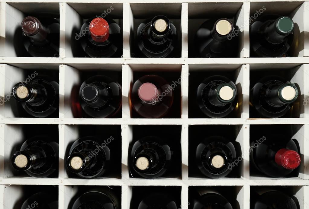 Wine bottles on wooden racks 