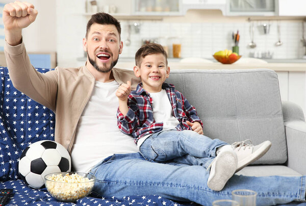 Father and son watching TV 