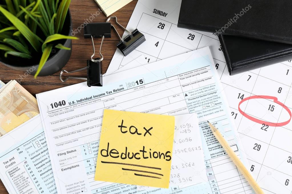Paper sheet with text TAX DEDUCTIONS