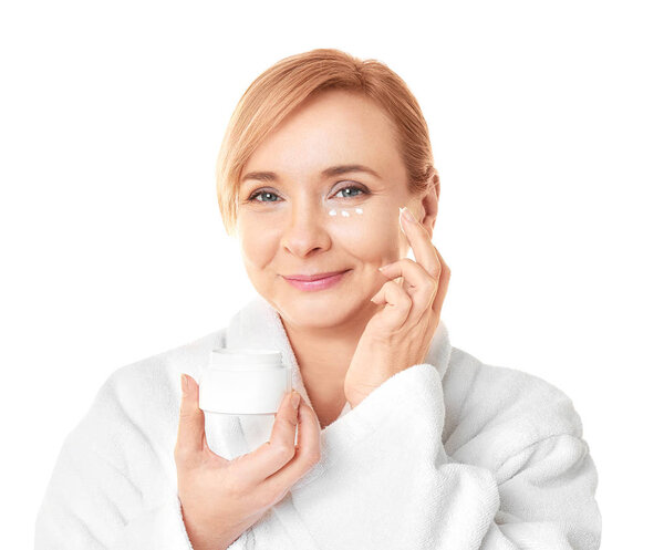 Senior woman applying anti-aging cream