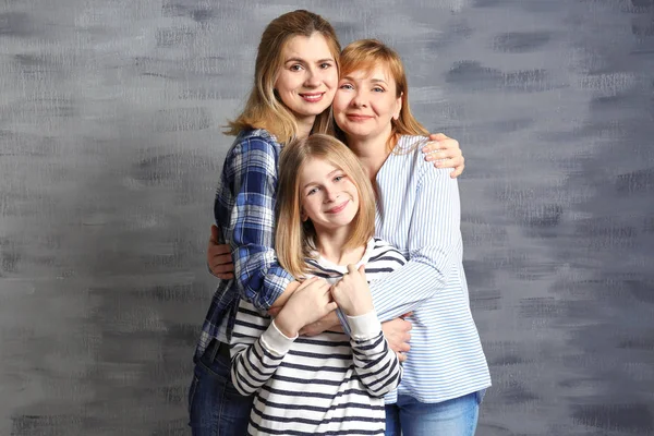 Young woman with mother and daughter — Stock Photo, Image