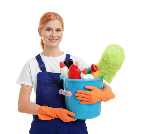 Woman holding bucket with cleaning agents and supplies on white background — Stock Photo, Image