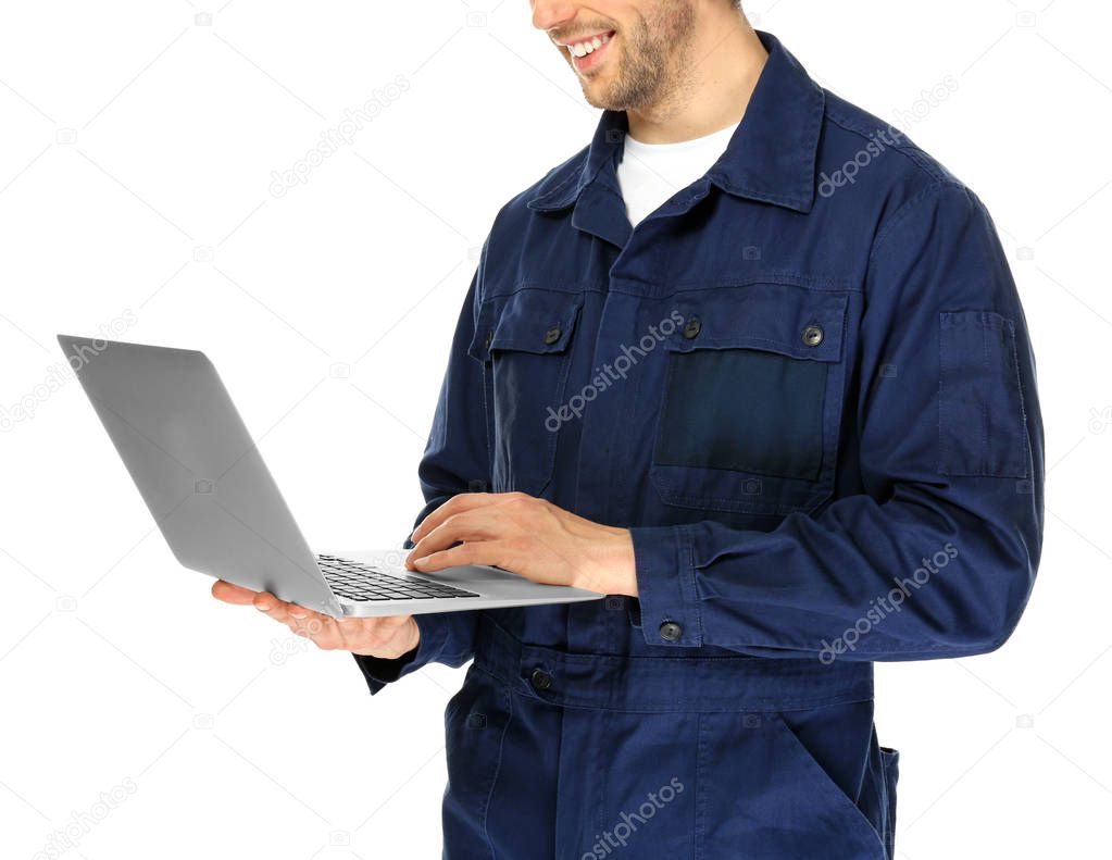 Handsome auto mechanic with laptop 