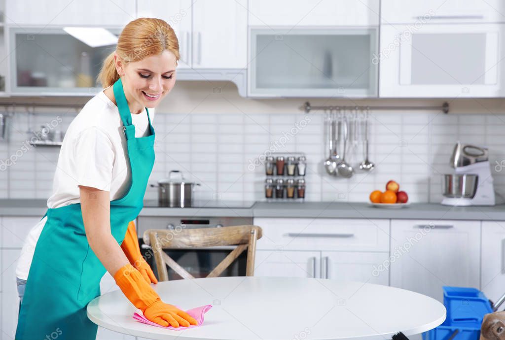 Woman cleaning table
