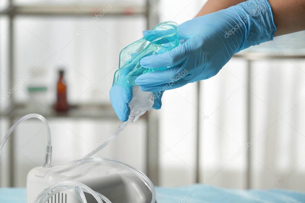 Doctor preparing compressor nebulizer for use