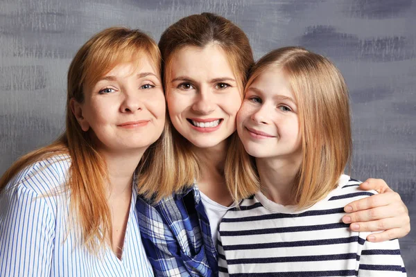 Young woman with mother and daughter — Stock Photo, Image