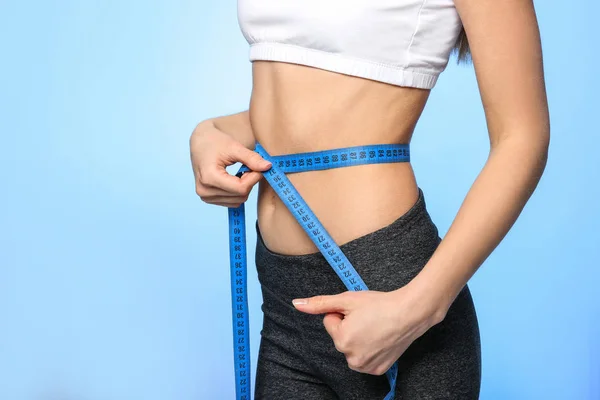 Woman with measuring tape — Stock Photo, Image