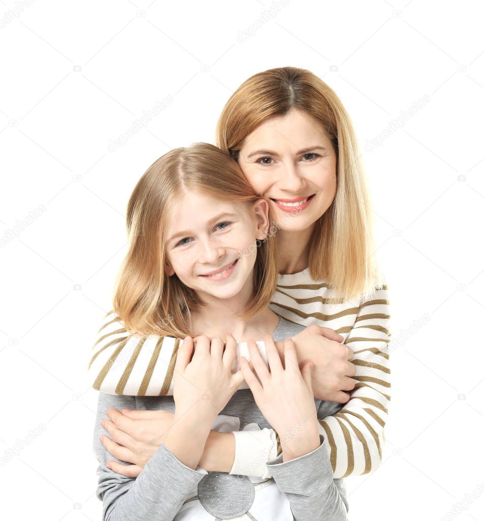 Happy mother and daughter on white background