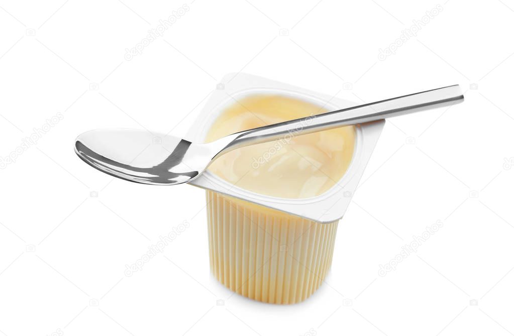 Plastic cup with yogurt and spoon on white background