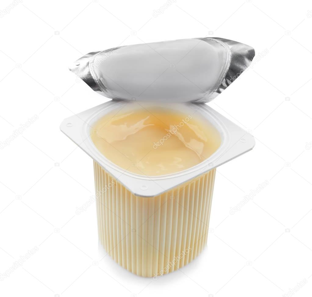 Plastic cup with yogurt on white background