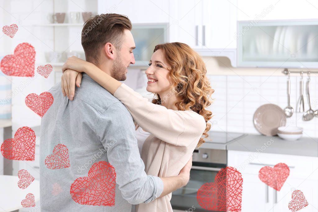 Young beautiful couple embracing at home