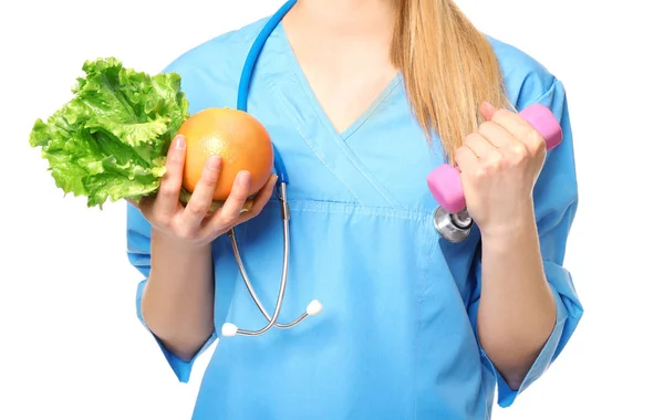 Nutritionist with grapefruit and dumbbell — Stock Photo, Image