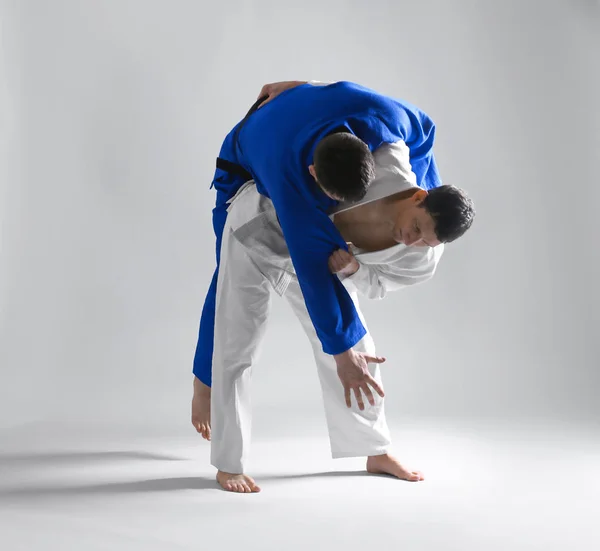 Men practicing martial arts