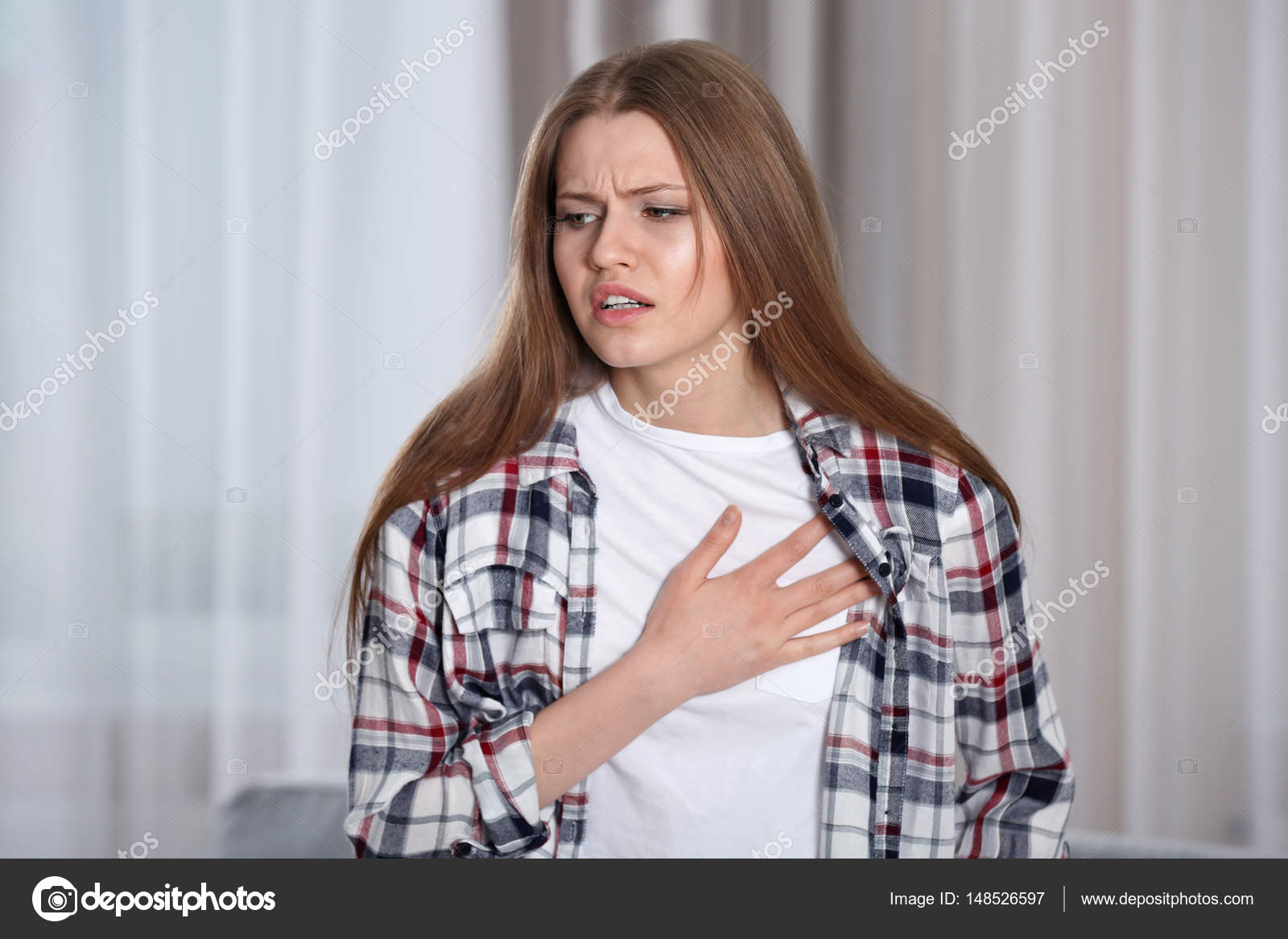 Girl Having A Heart Attack At Home Stock Photo Image By C Belchonock 148526597