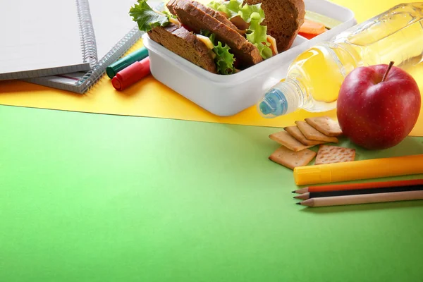 School lunch and stationery on table