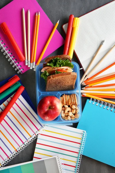 School lunch and stationery on table — Stock Photo, Image