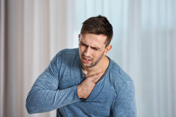 Man having a heart attack at home