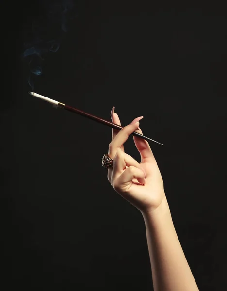 Female hand with cigarette holder — Stock Photo, Image