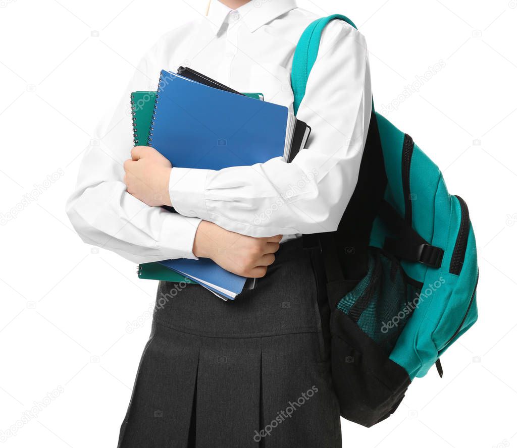 Cute girl in school uniform on white background