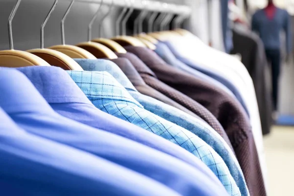 Rack with shirts in shop — Stock Photo, Image