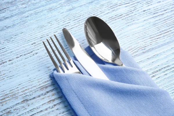 Cutlery set with folded napkin — Stock Photo, Image