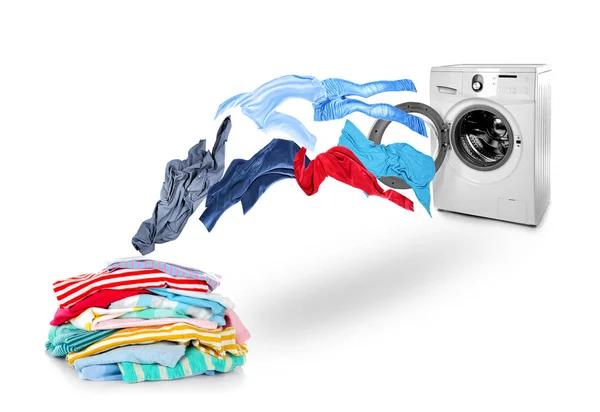 Washing machine and flying clothes — Stock Photo, Image