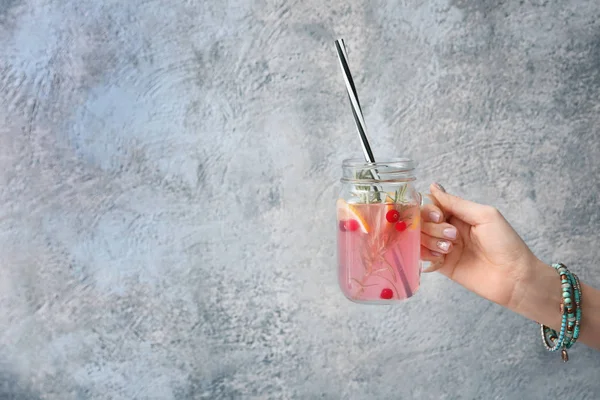 Hand with jar of fresh lemonade — Stock Photo, Image
