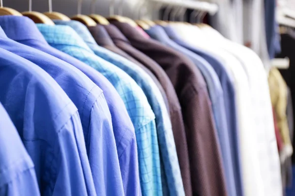 Rack with shirts in shop — Stock Photo, Image