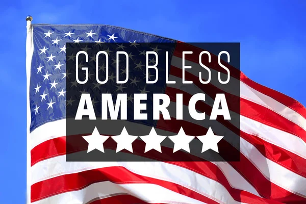 Текст Бог благословить Америку — стокове фото