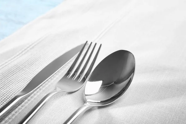 Cutlery set on linen napkin