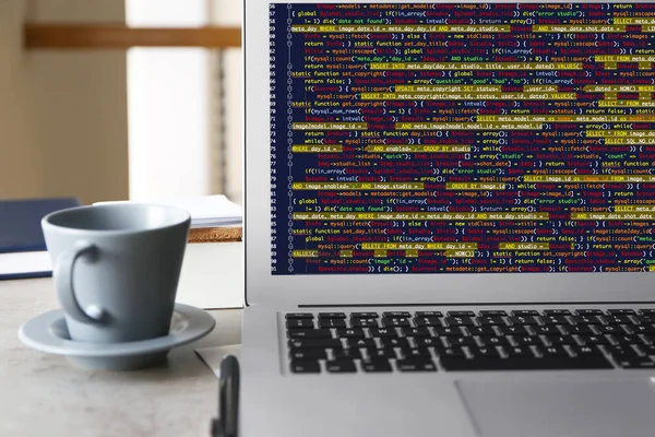 Laptop of programmer with script code — Stock Photo, Image