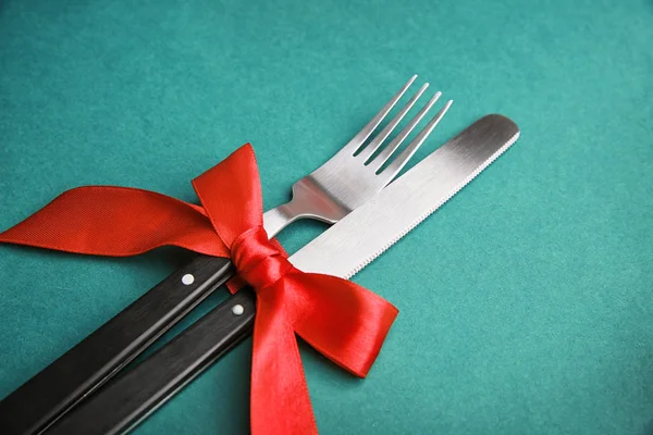 Fork and knife with ribbon bow Royalty Free Stock Photos