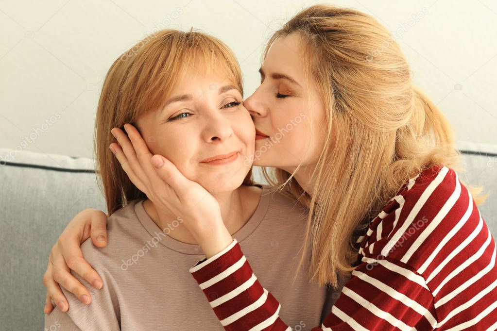 Happy young woman with mother 