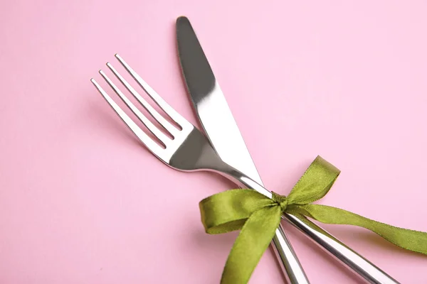 Fork and knife with ribbon bow — Stock Photo, Image