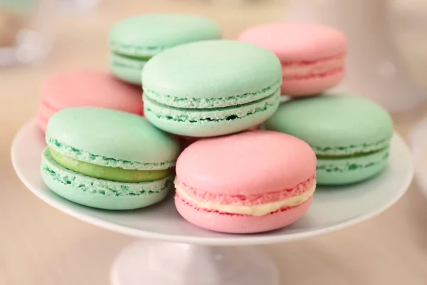 Stand with tasty macarons — Stock Photo, Image