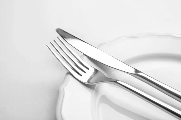 Fork and knife on plate — Stock Photo, Image