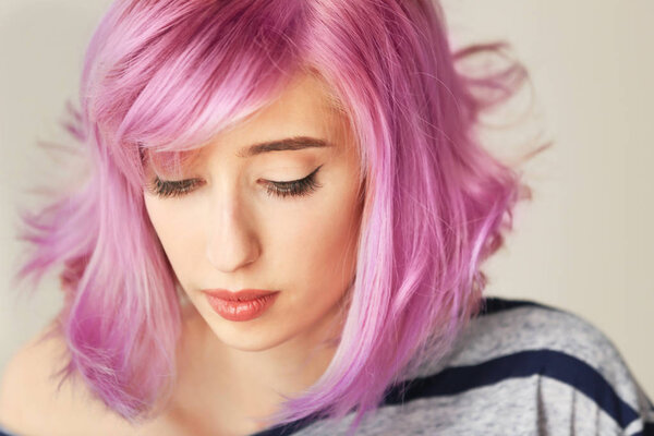Beautiful young woman with dyed hair  