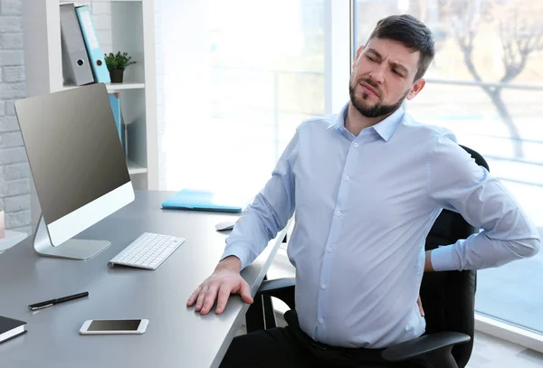 Man suffering from back pain — Stock Image Man suffering from back pain Stock Picture