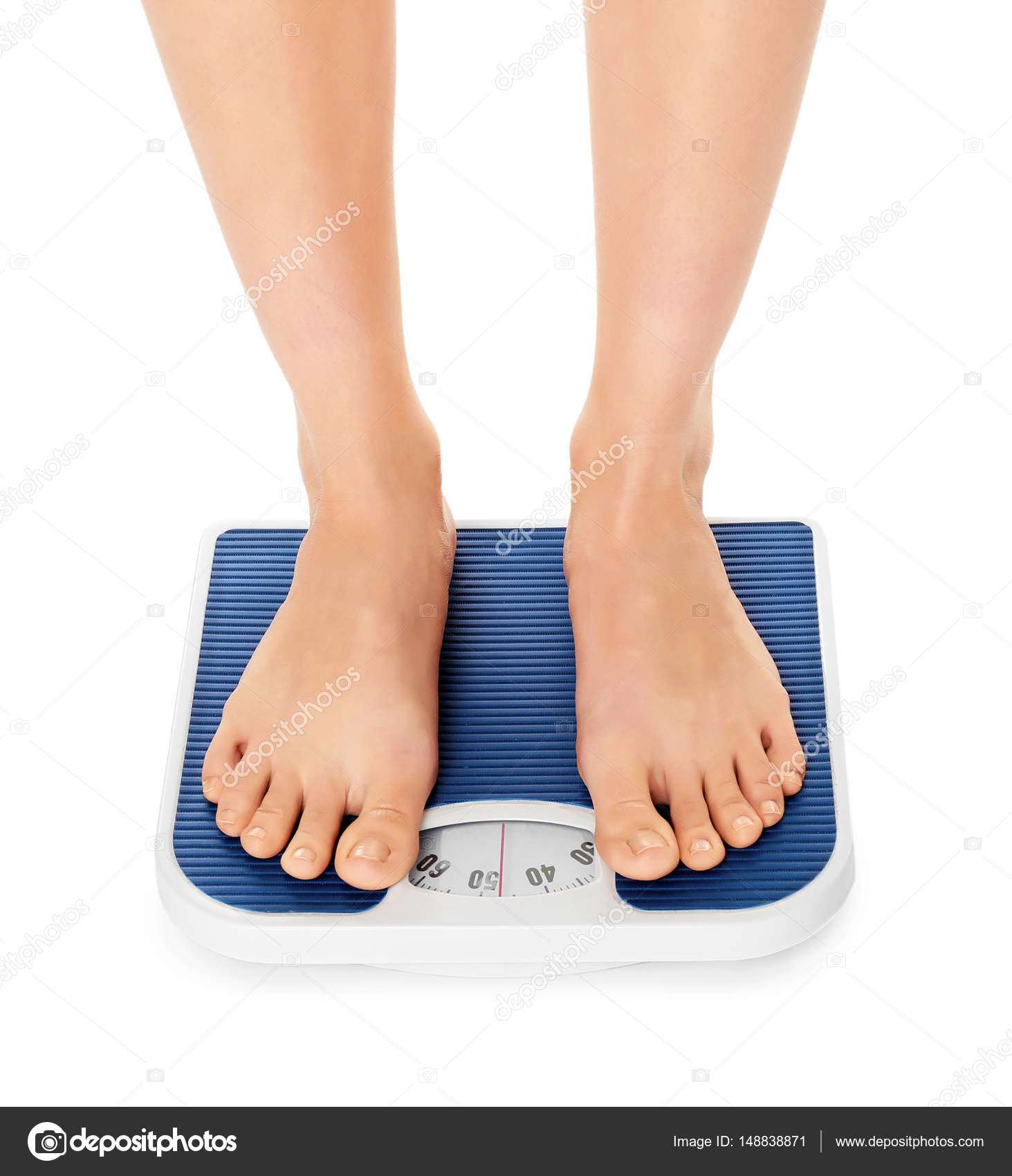 Woman standing on scales Stock Photo by ©belchonock 148838871