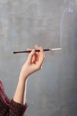  hand with cigarette holder  clipart